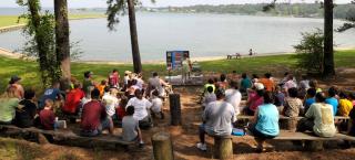A small crowd at the state park participating in a presentation.
